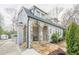 Charming two-story home featuring stone arches, a stucco exterior, and a well-manicured front yard at 1195 Cameron Ne Ct, Atlanta, GA 30306