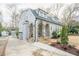 Charming home with stone arches, landscaped yard, and long driveway at 1195 Cameron Ne Ct, Atlanta, GA 30306