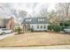 Charming home with arched stone entryway, dormer windows, and well-manicured front yard at 1195 Cameron Ne Ct, Atlanta, GA 30306