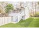 A detached guest house with a screened porch and manicured lawn at 1195 Cameron Ne Ct, Atlanta, GA 30306