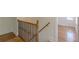Upstairs hardwood hallway with decorative railing and natural light at 1195 Cameron Ne Ct, Atlanta, GA 30306
