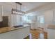 Modern kitchen with granite countertops, white cabinets, and stainless steel appliances at 1195 Cameron Ne Ct, Atlanta, GA 30306