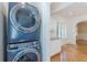 Convenient laundry area featuring modern stacked washer and dryer units at 1195 Cameron Ne Ct, Atlanta, GA 30306