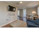 Living room with TV, hardwood floors, and comfortable chair at 1195 Cameron Ne Ct, Atlanta, GA 30306