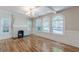 Bright living room with fireplace, hardwood floors and arched windows at 1195 Cameron Ne Ct, Atlanta, GA 30306