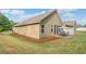 Rear exterior of the home with a patio area and well-maintained lawn at 155 Point View Dr, Canton, GA 30114