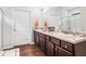 Bathroom with double vanity, granite counters, and wood-look flooring at 155 Point View Dr, Canton, GA 30114