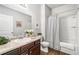 Well-lit bathroom featuring granite countertop and shower/tub combo at 155 Point View Dr, Canton, GA 30114