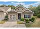 Beautiful home with manicured landscaping and double garage doors at 155 Point View Dr, Canton, GA 30114