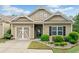 Charming home with a well-manicured lawn, tidy garden beds, and a cozy covered front entry at 155 Point View Dr, Canton, GA 30114