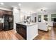 Open-concept kitchen and living area with a center island, stainless steel appliances, and modern finishes at 155 Point View Dr, Canton, GA 30114