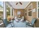 A cozy screened porch with comfortable seating, creating a perfect spot for relaxation and enjoying the outdoors at 155 Point View Dr, Canton, GA 30114