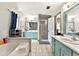 Large bathroom with a soaking tub, separate vanities, and a glass-enclosed shower at 3157 Brooks Dr, Snellville, GA 30078