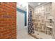 Updated bathroom with a tiled shower, neutral color scheme, and modern fixtures at 3157 Brooks Dr, Snellville, GA 30078
