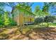 A wooded lot surrounds this two story home, offering privacy and shade at 3157 Brooks Dr, Snellville, GA 30078