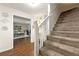 Welcoming foyer featuring hardwood floors and a carpeted staircase at 3157 Brooks Dr, Snellville, GA 30078