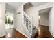 Inviting foyer with hardwood floors, a staircase, and views into other rooms at 3157 Brooks Dr, Snellville, GA 30078