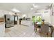 Spacious kitchen with stainless steel refrigerator, white cabinets, tile flooring, and dining area at 3157 Brooks Dr, Snellville, GA 30078