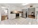 Spacious kitchen with white cabinets, tile floors, and stainless steel appliances at 3157 Brooks Dr, Snellville, GA 30078