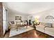 Bright living room with hardwood floors, neutral decor, and ample natural light at 3157 Brooks Dr, Snellville, GA 30078
