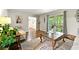 Cozy living room featuring hardwood floors and large windows overlooking the yard at 3157 Brooks Dr, Snellville, GA 30078