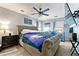 Main bedroom with a fan, mounted TV, neutral colored walls, and carpet flooring at 3157 Brooks Dr, Snellville, GA 30078