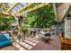 Charming outdoor deck area with pergola, grill, heater, and seating at 342 5Th Ne St, Atlanta, GA 30308