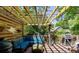Inviting outdoor deck with pergola, string lights, comfortable seating and a grill at 342 5Th Ne St, Atlanta, GA 30308