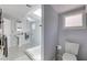 Bright bathroom features a walk-in glass shower, black and white tile and modern fixtures at 342 5Th Ne St, Atlanta, GA 30308