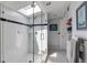 Modern bathroom features skylight, glass shower, and black and white tiled floors at 342 5Th Ne St, Atlanta, GA 30308