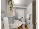 Cozy bathroom with a pedestal sink, tiled floors, and a shower with gray subway tile at 342 5Th Ne St, Atlanta, GA 30308