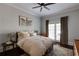 Bright primary bedroom featuring neutral walls, queen size bed, and access to a balcony at 342 5Th Ne St, Atlanta, GA 30308