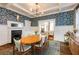 Dining room showcasing a hardwood floor, coffered ceiling, a fireplace, and charming decor at 342 5Th Ne St, Atlanta, GA 30308