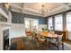 Elegant dining room features stylish wallpaper, coffered ceiling, and ample natural light at 342 5Th Ne St, Atlanta, GA 30308