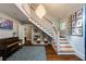 Grand foyer features a staircase, chandelier, and hardwood floors at 342 5Th Ne St, Atlanta, GA 30308