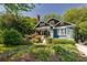 Charming home exterior featuring a well-manicured lawn and a welcoming front porch at 342 5Th Ne St, Atlanta, GA 30308