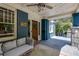 Inviting front porch with stylish seating, string lights, and a ceiling fan for outdoor relaxation at 342 5Th Ne St, Atlanta, GA 30308