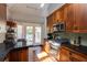 Bright kitchen with access to outdoor deck featuring stainless steel appliances and granite countertops at 342 5Th Ne St, Atlanta, GA 30308