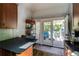 View of the kitchen area leading out to an outdoor deck and seating area, ideal for entertaining guests at 342 5Th Ne St, Atlanta, GA 30308