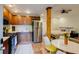 A cozy kitchen and living area with a gas range, stainless steel appliances, and tile flooring at 342 5Th Ne St, Atlanta, GA 30308