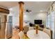 Open-concept living space with modern furnishings, stainless steel appliances, and access to the bedroom at 342 5Th Ne St, Atlanta, GA 30308