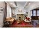 Cozy living room with coffered ceilings, stone fireplace, and comfortable seating at 342 5Th Ne St, Atlanta, GA 30308