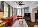 Cozy living room with hardwood floors, large windows, comfortable seating, and modern entertainment setup at 342 5Th Ne St, Atlanta, GA 30308