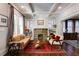 Cozy living room with a stone fireplace, built-in shelving, and ample natural light at 342 5Th Ne St, Atlanta, GA 30308