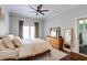 Bright main bedroom featuring neutral walls, wood floors, and a private door to an outdoor balcony at 342 5Th Ne St, Atlanta, GA 30308
