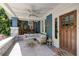 Inviting front porch with comfortable seating, string lights, ceiling fan, and stylish decor at 342 5Th Ne St, Atlanta, GA 30308