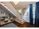 Elegant staircase features detailed white banisters and hardwood steps, complemented by a stylish display at 342 5Th Ne St, Atlanta, GA 30308