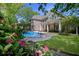 A backyard pool offers a refreshing escape with a charming pergola and lovely landscaping at 3590 Fricks Rd, Marietta, GA 30062
