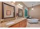 Bathroom features double vanity, granite countertops, and soaking tub next to a sunlit window at 3590 Fricks Rd, Marietta, GA 30062