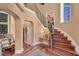 Grand foyer showcases hardwood floors, staircase, and elegant decor at 3590 Fricks Rd, Marietta, GA 30062